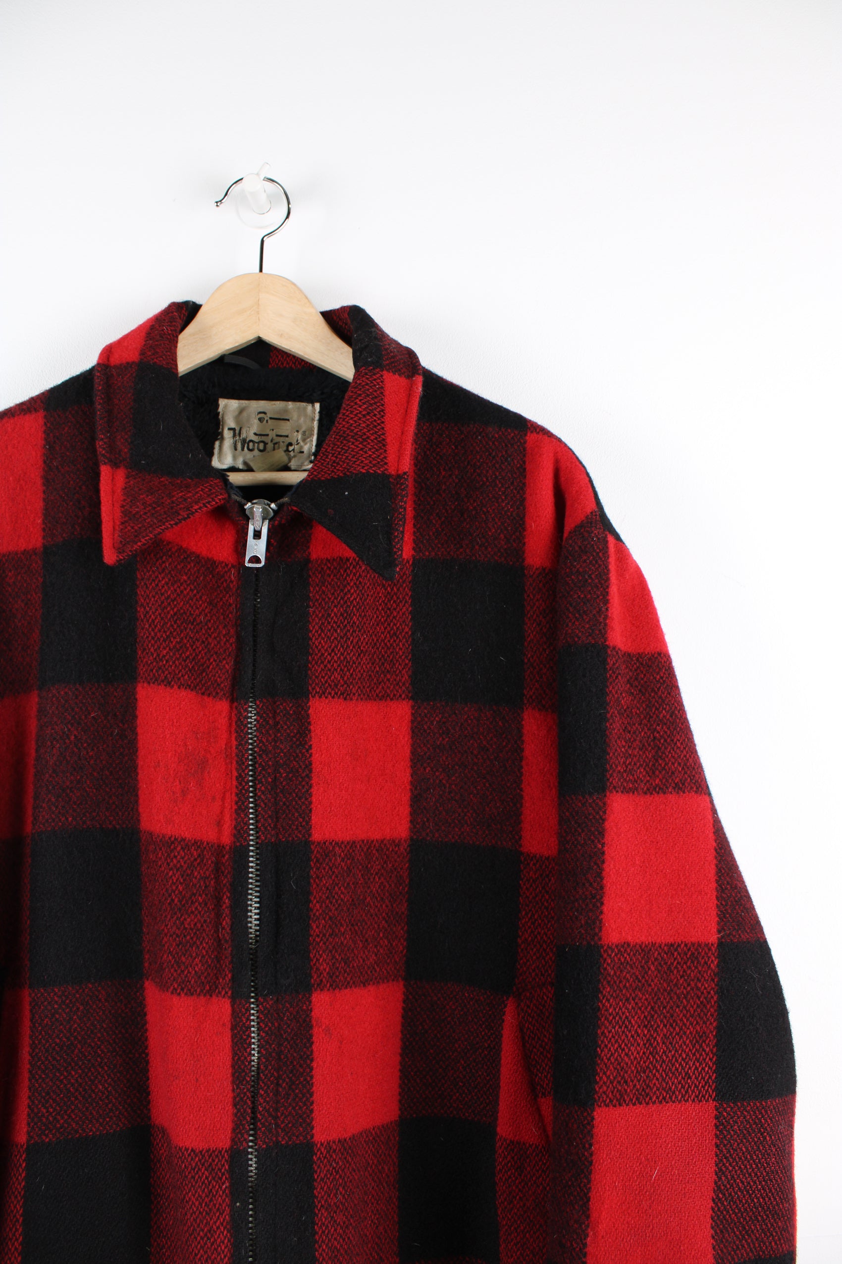 Vintage Woolrich red & black plaid wool CPO jacket, zip up with side pockets and fleece lining.