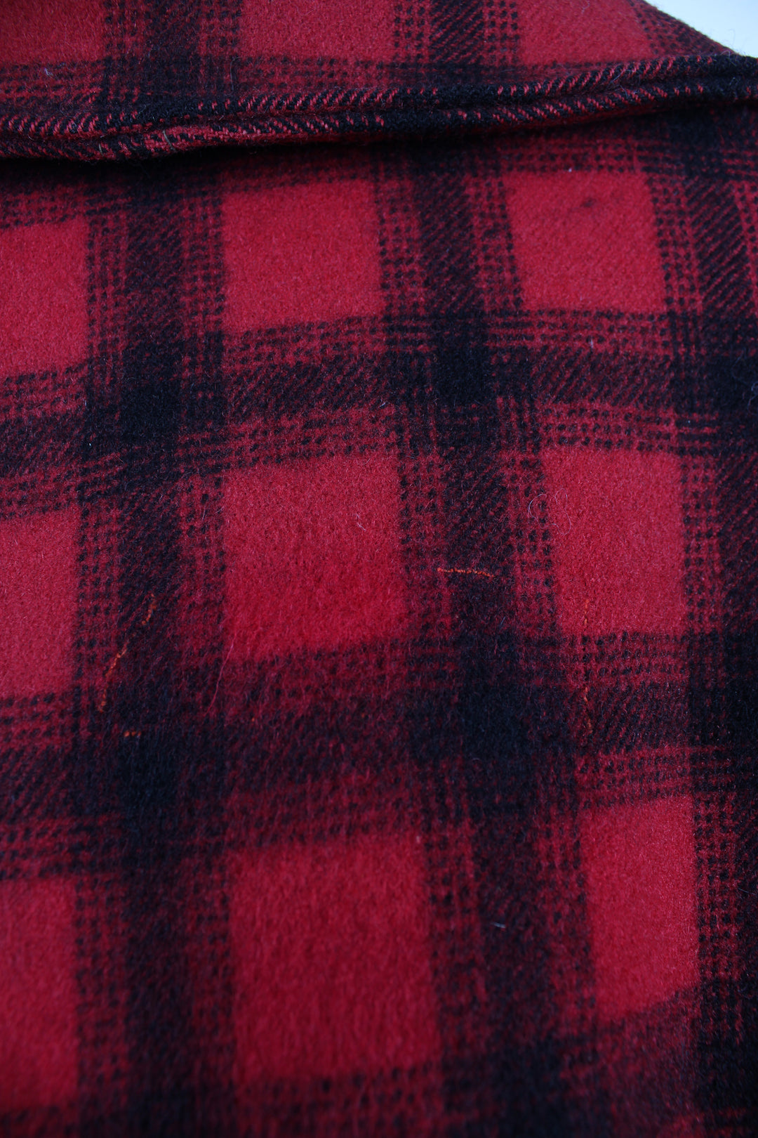 Vintage 1970's Woolrich red & black plaid wool button up CPO jacket with multiple pockets.