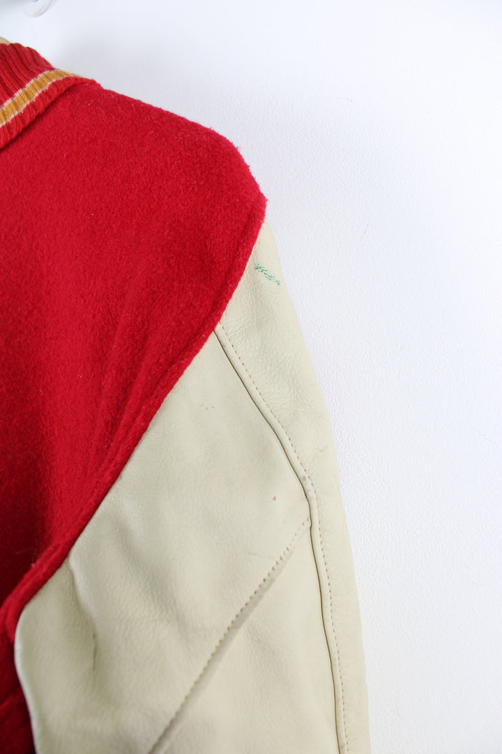 Vintage 70's college varsity jacket, button up with embroidered patches throughout the jacket. 