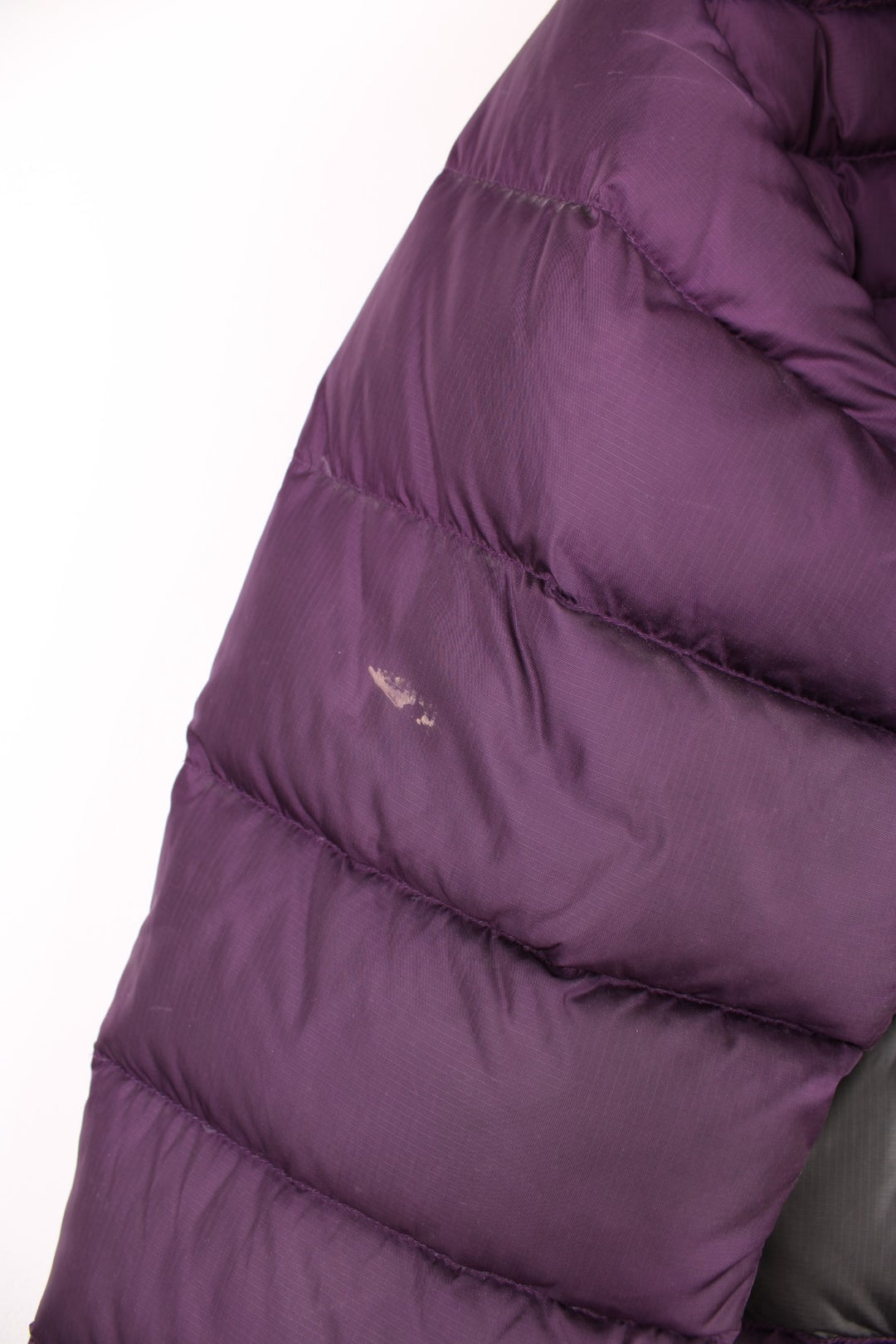 Rab Extreme Puffer Jacket in a purple colourway, zip up with side pockets, has a detachable hood, insulated, and has the logo embroidered on the front.