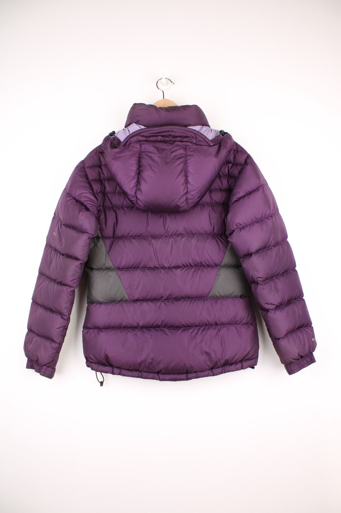 Rab Extreme Puffer Jacket in a purple colourway, zip up with side pockets, has a detachable hood, insulated, and has the logo embroidered on the front.