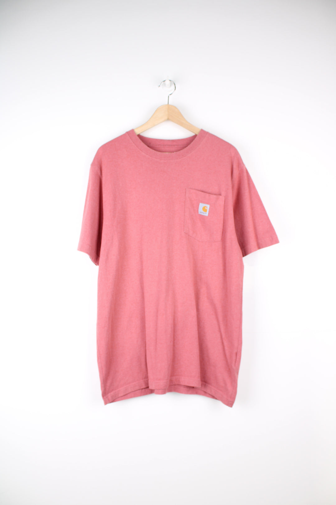 Carhartt T-Shirt in a pink colourway, has a chest pocket and the logo embroidered on it.