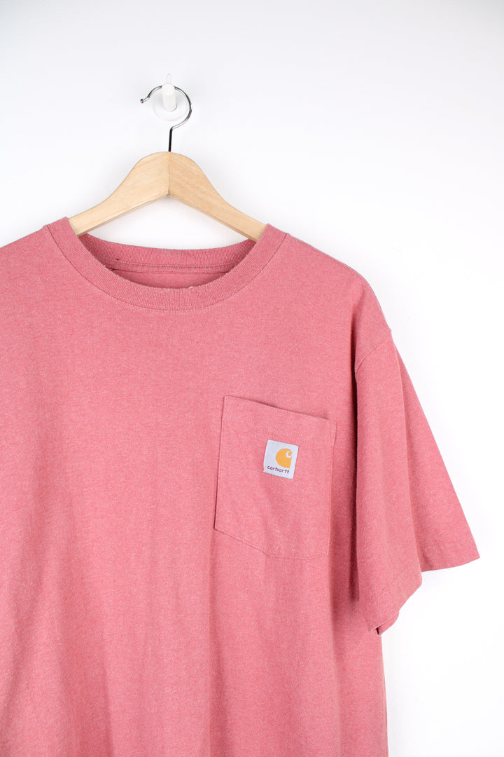 Carhartt T-Shirt in a pink colourway, has a chest pocket and the logo embroidered on it.