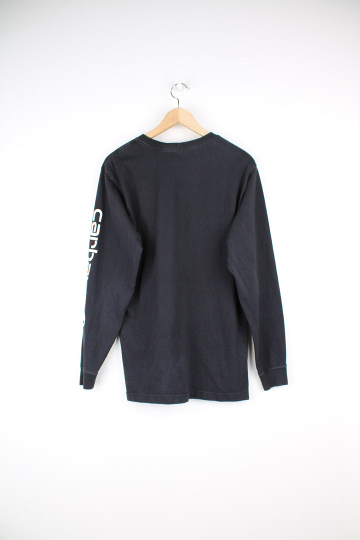 Carhartt Long Sleeve T-Shirt in a black colourway with white printed Carhartt spell out going down the left sleeve.