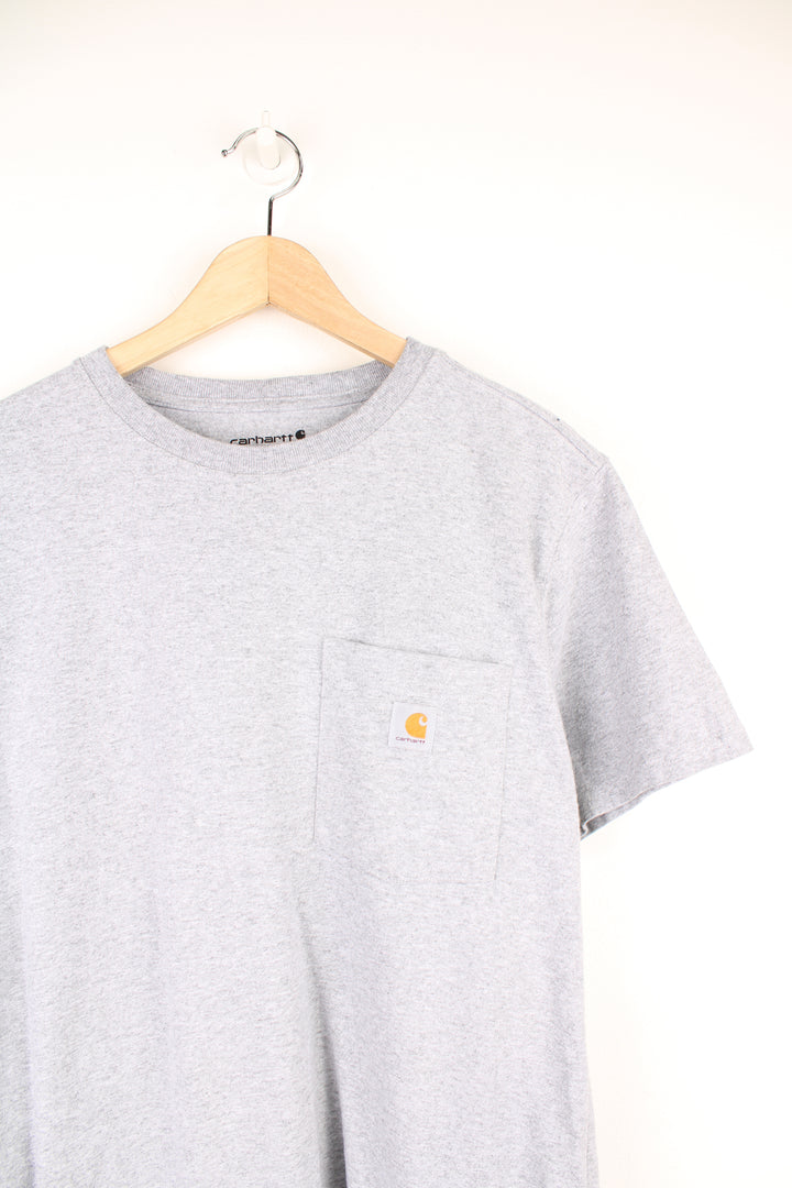 Carhartt T-Shirt in a grey colourway, has a chest pocket with the logo embroidered on it.