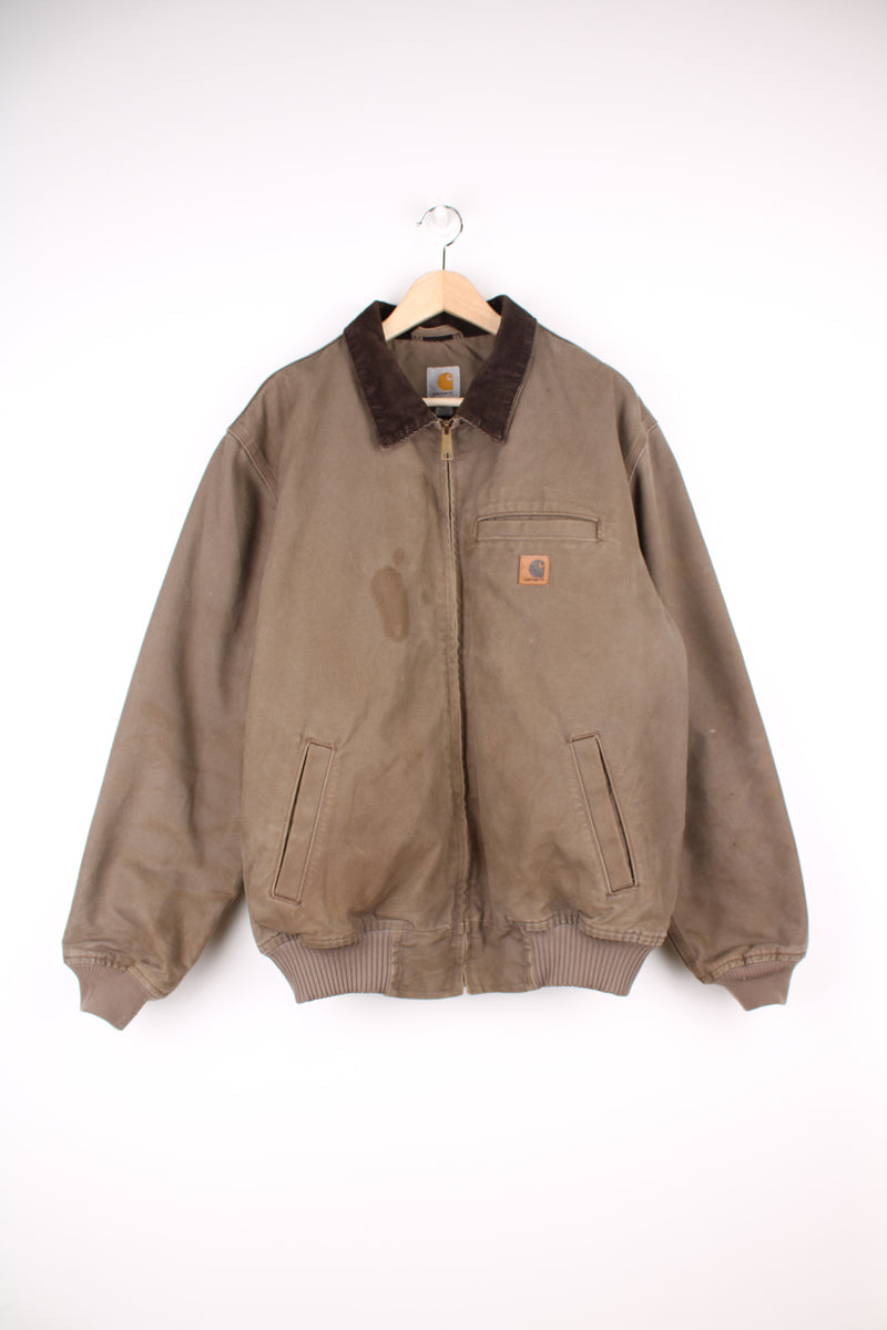 Carhartt Detroit Jacket in a brown colourway with a corduroy collar, zip up, multiple pockets, and has the logo embroidered on the front.