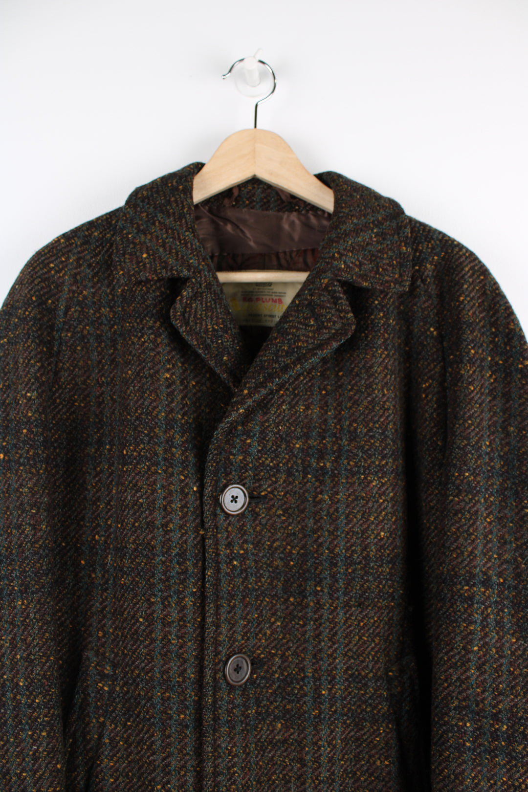 Vintage Aquascutum wool overcoat, button up, has a quilted lining, and side pockets.