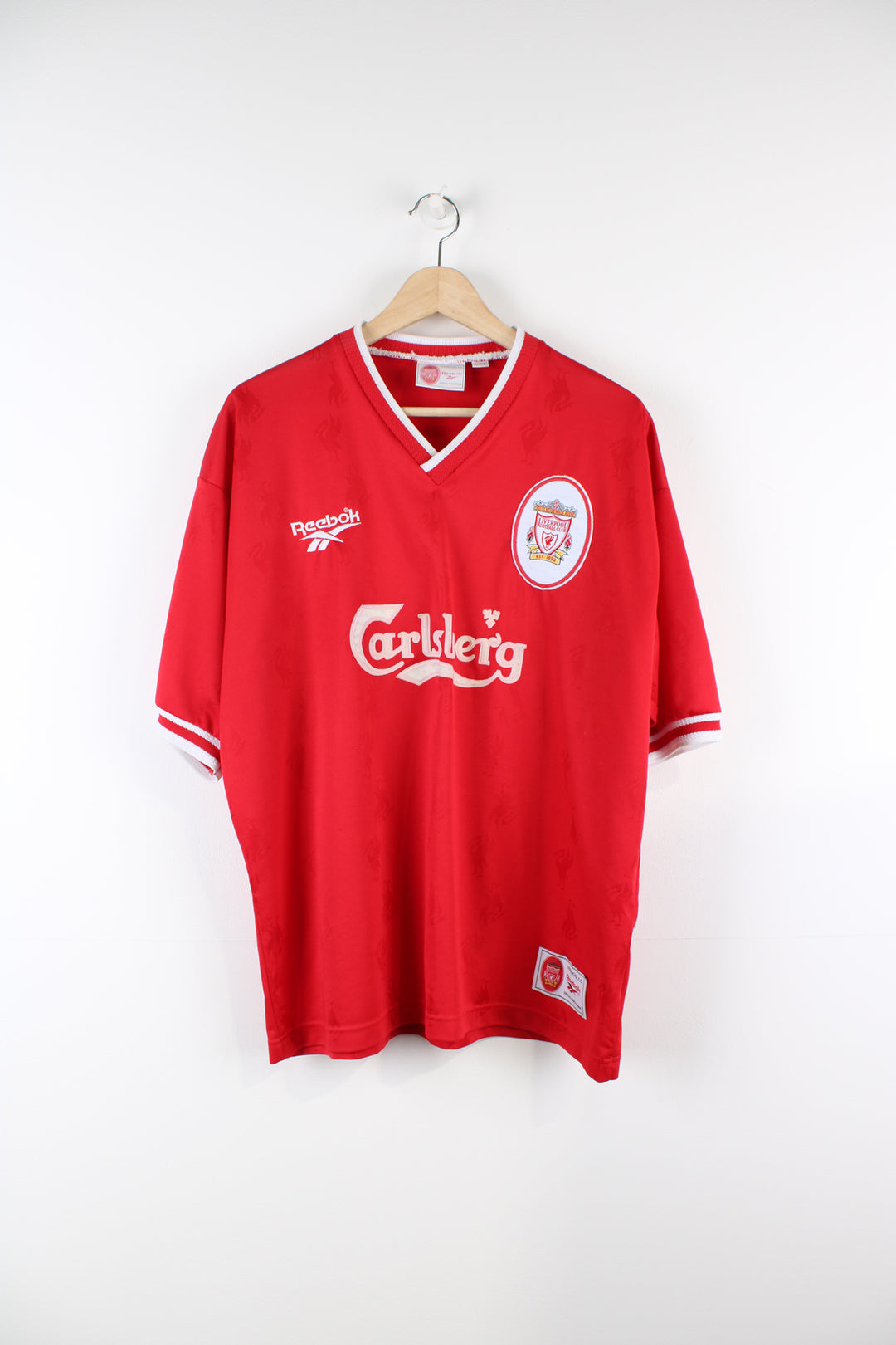 Vintage Liverpool Reebok Home kit 1996/98, Carlsberg sponsor, v neck, red team colourway with embroidered logos on the front.