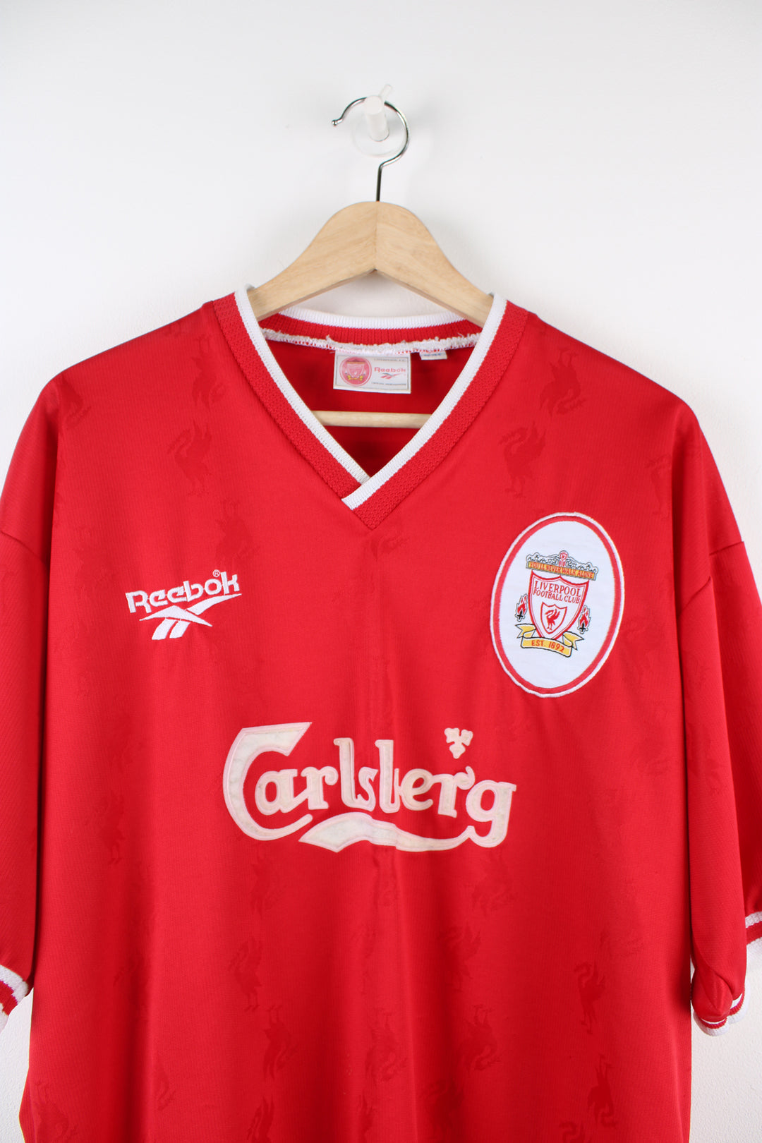 Vintage Liverpool Reebok Home kit 1996/98, Carlsberg sponsor, v neck, red team colourway with embroidered logos on the front.