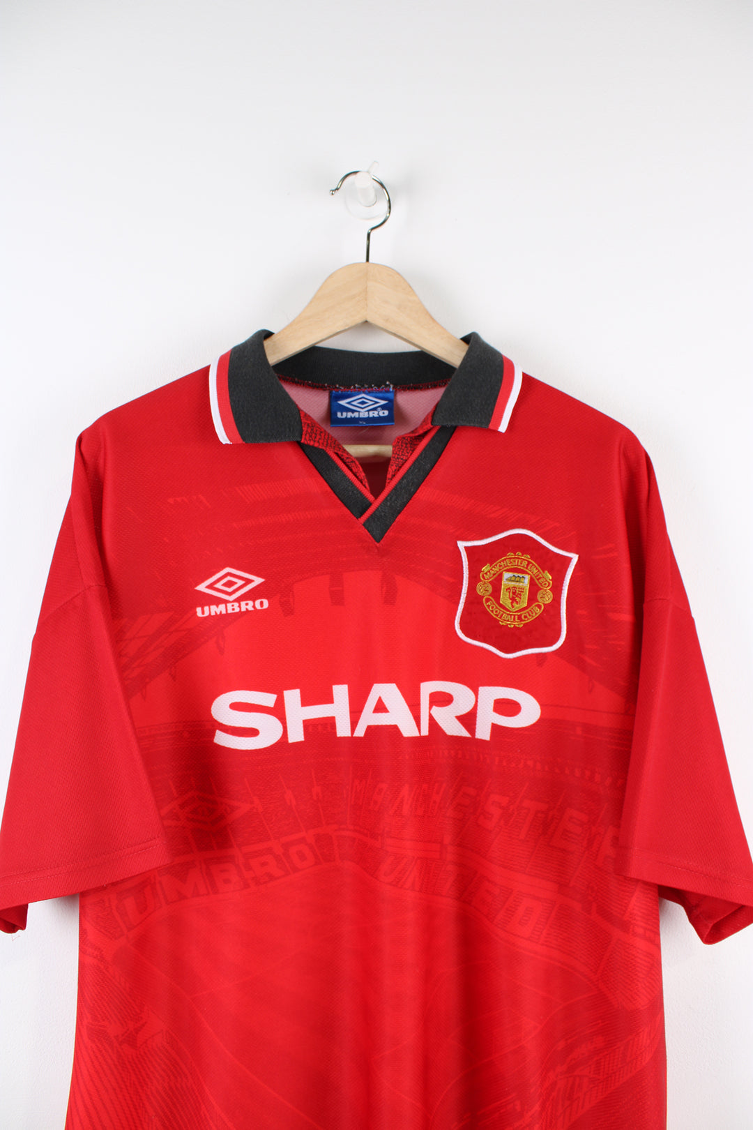 Manchester United Umbro 1994/96 home football shirt, red team colourway, Old Trafford design and has embroidered logos on the front.