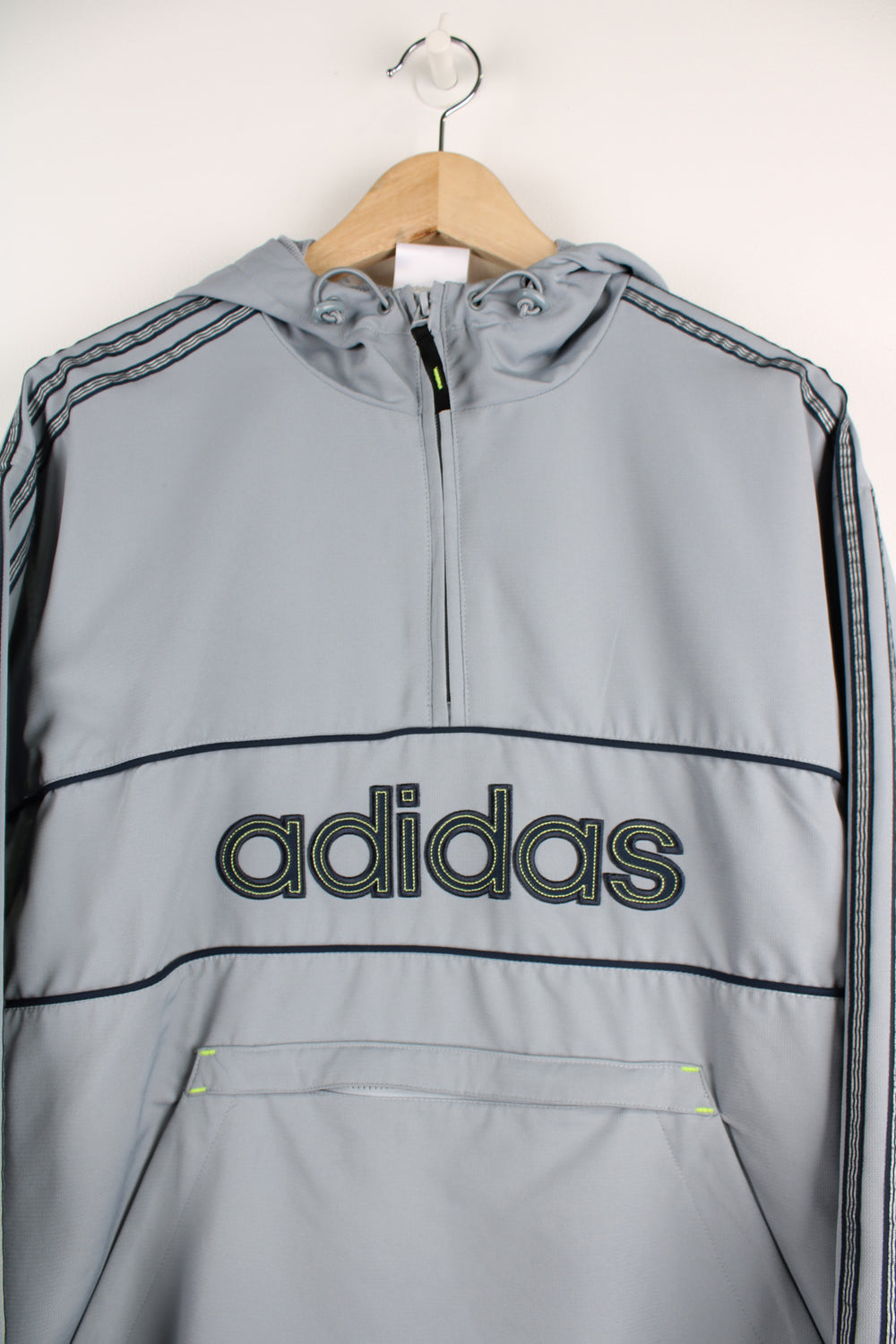 Vintage Adidas lightweight pullover in all grey, features embroidered spell-out logo across the chest with large zip up pocket in the front&nbsp;