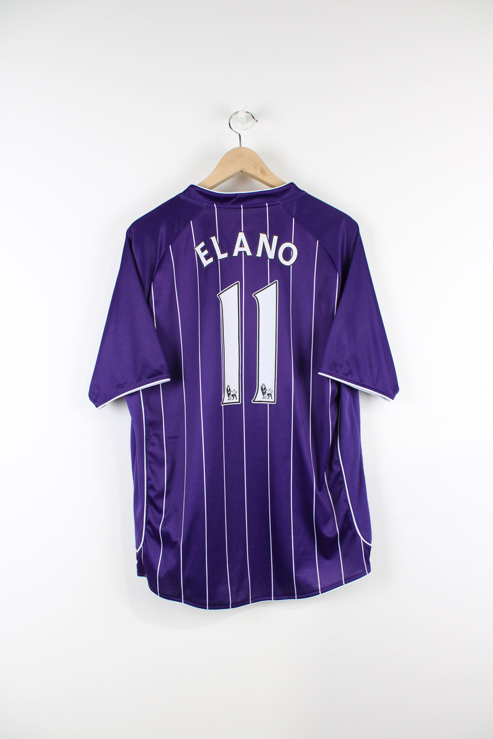 Manchester City 2007/08 Le Coq Sportif away football shirt, Ellano number 11 kit, purple and white colourway with embroidered logos on the front.