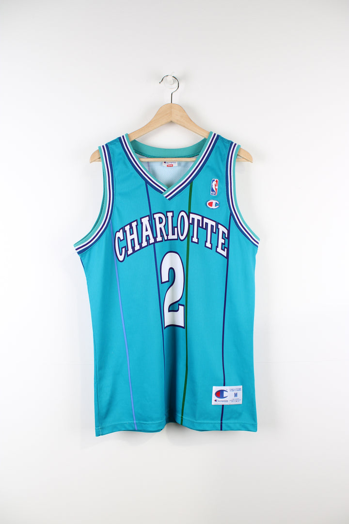 Vintage 90's Charlotte Hornets Champion jersey, Larry Johnson #2 kit, blue, purple and white colourway, and embroidered logos. 