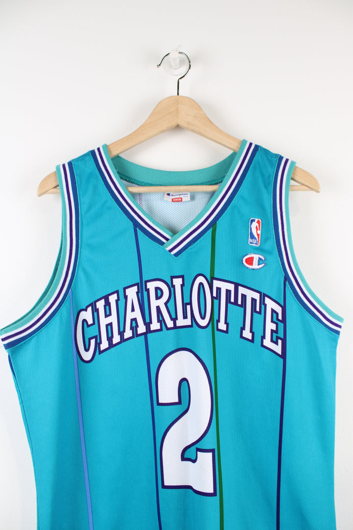 Vintage 90's Charlotte Hornets Champion jersey, Larry Johnson #2 kit, blue, purple and white colourway, and embroidered logos. 