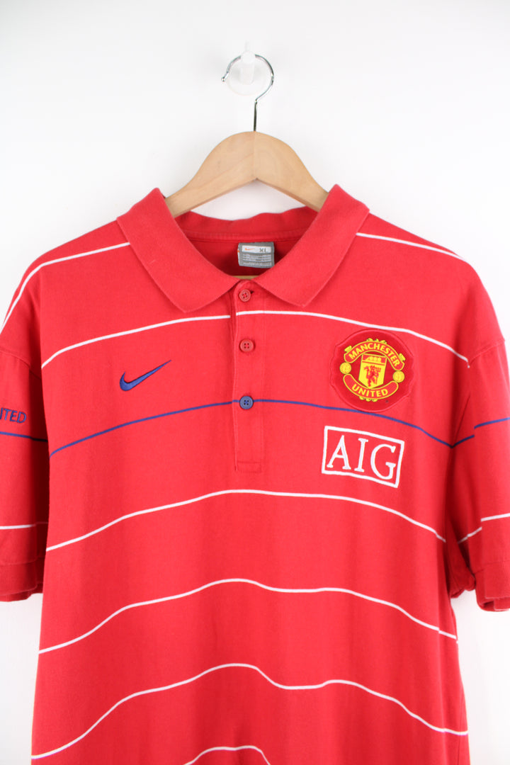 Vintage Manchester United, Nike Polo Shirt in a red, white and blue striped colourway, button up and has logos embroidered throughout the shirt.