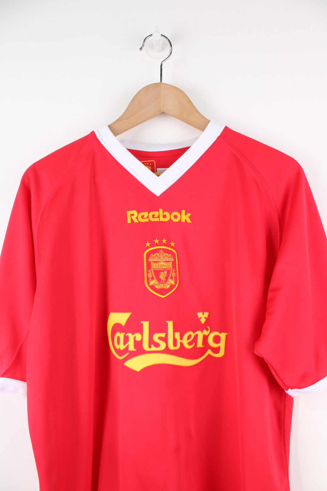 Vintage Liverpool 2001/03 Champions League, Reebok Football Shirt in a red, white and yellow colourway, John Arne Riise number 18 printed on the back, V-neck, and has logos embroidered on the front and sleeve.