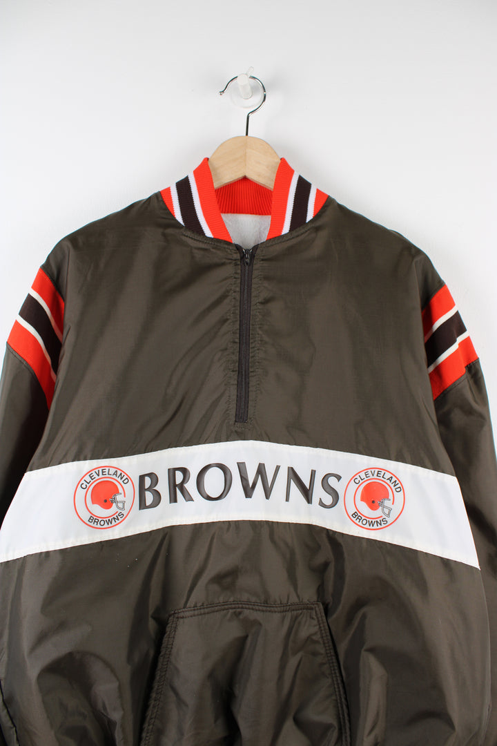 Vintage Cleveland Browns NFL pullover jacket, brown, white and orange team colourway, half zip up, front pocket, and has Browns spell-out and logo across the front. 