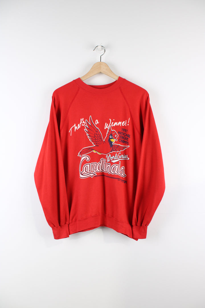 Vintage Louisville Cardinals MLB 1987 national league champions sweatshirt in red, graphic design and spell-out on the front.