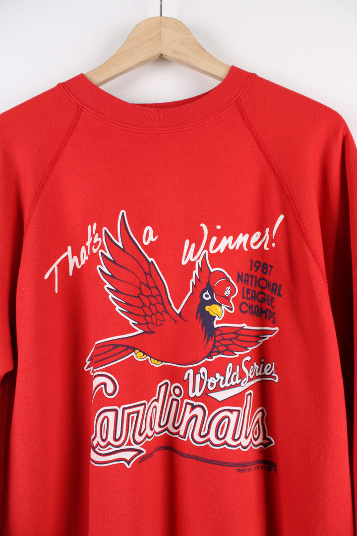 Vintage Louisville Cardinals MLB 1987 national league champions sweatshirt in red, graphic design and spell-out on the front.