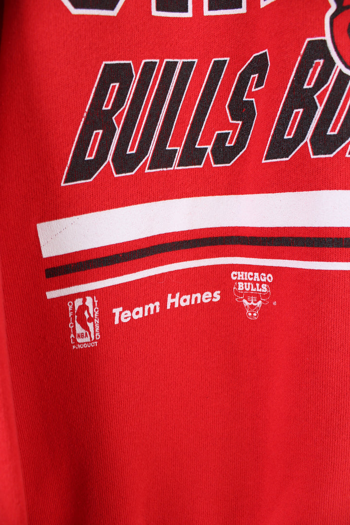 Vintage 90's Chicago Bulls NBA sweatshirt in red, has big logo graphic design across the front.