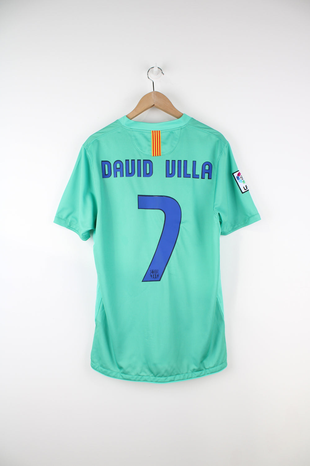 Barcelona 2010/11, Nike Away Football Kit in a green colourway, David Villa number 7 printed on the back, and has logos embroidered on the front.