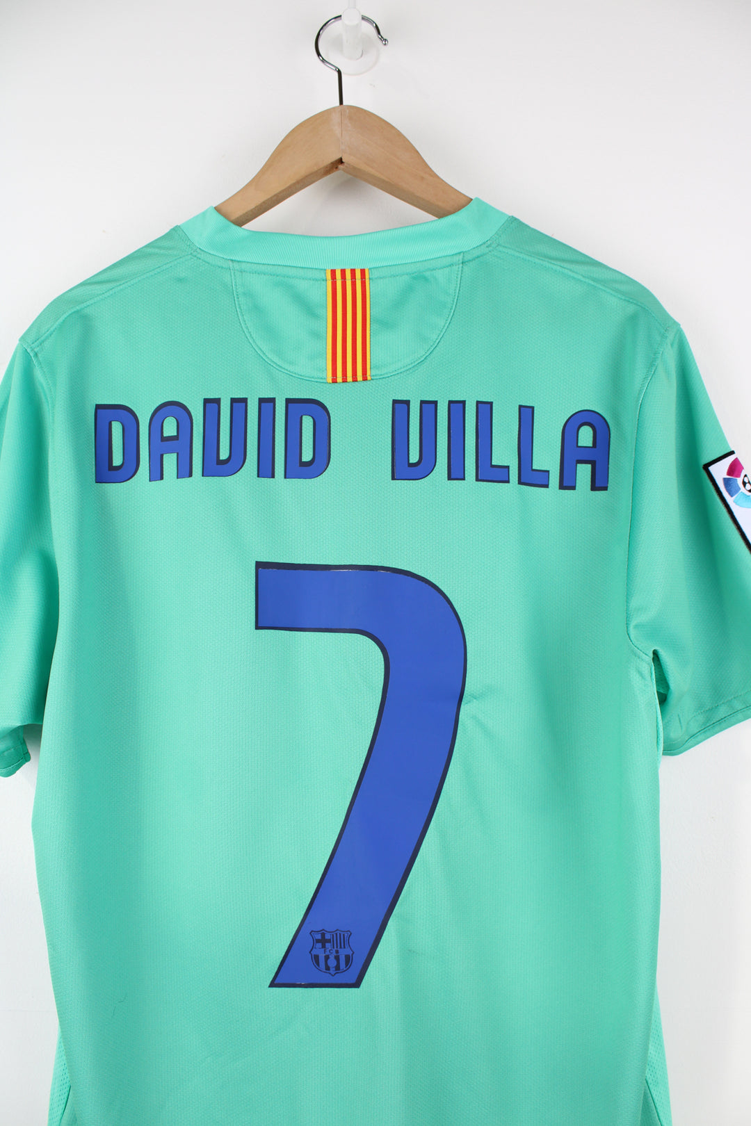 Barcelona 2010/11, Nike Away Football Kit in a green colourway, David Villa number 7 printed on the back, and has logos embroidered on the front.