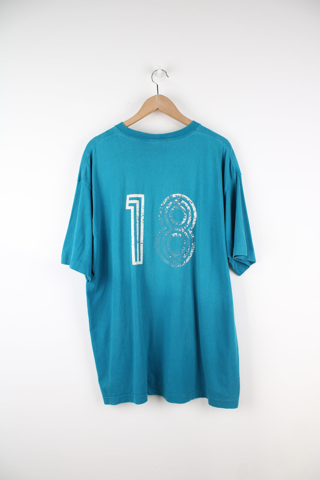 Vintage 90's Adidas, Coca Cola Single Stitch T-Shirt in a blue colourway, football graphic printed on the front alongside the Adidas logo, and number 18 printed on the back.