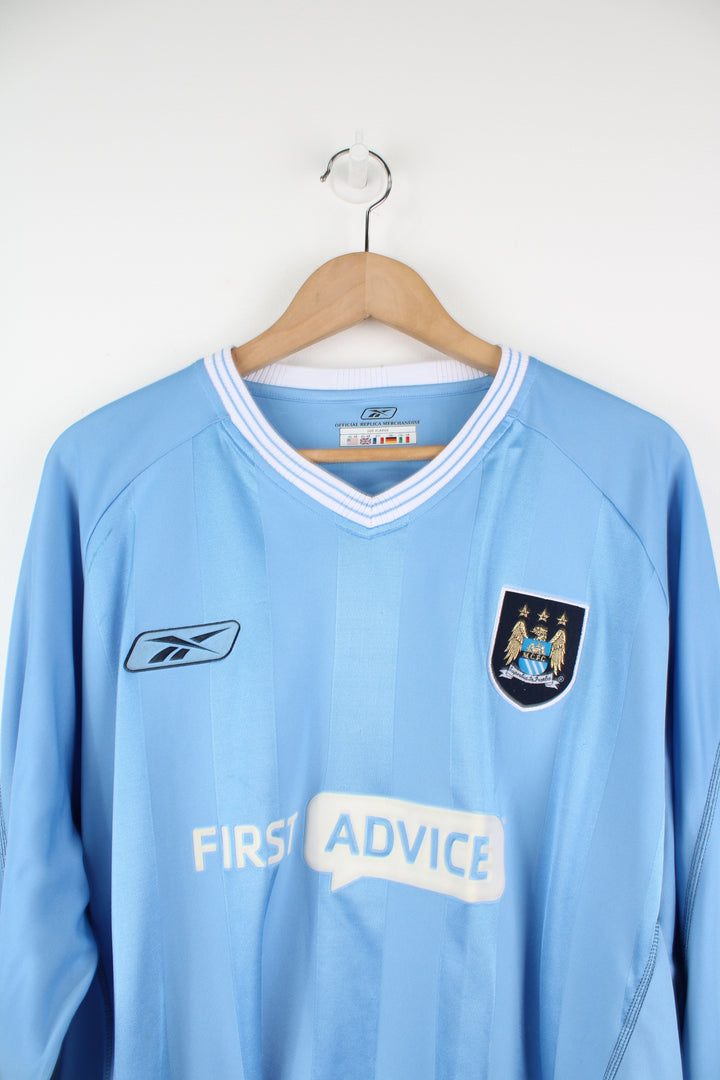 Manchester City 2003/04, Reebok Long Sleeved Football Kit in a blue colourway, and has logos embroidered on the front.