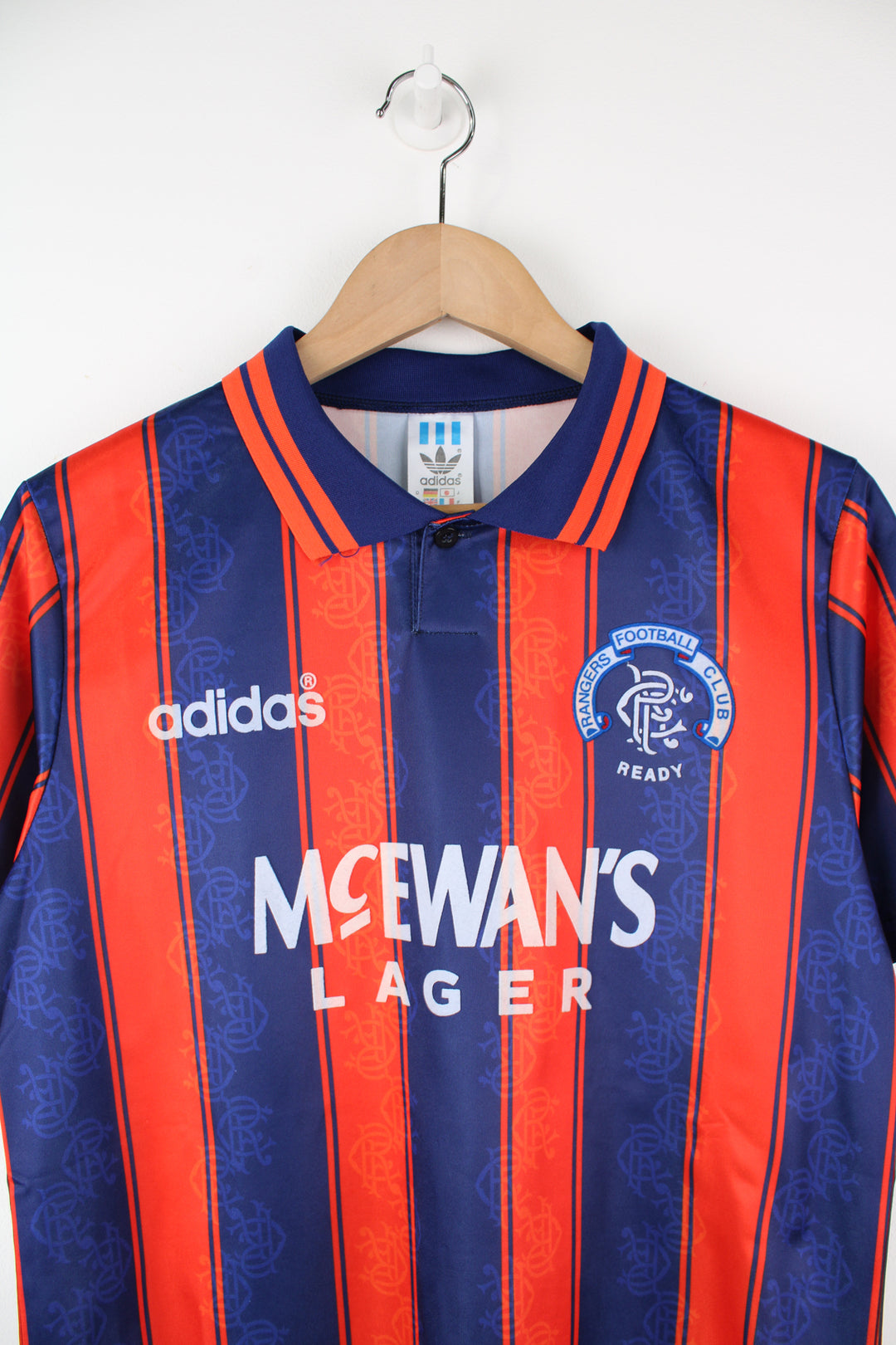 Vintage Rangers 1993/94, Adidas Football Kit in a blue and orange colourway, button up collar, and has logos printed on the front.