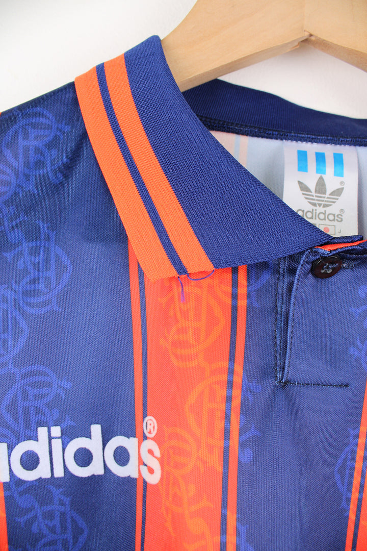 Vintage Rangers 1993/94, Adidas Football Kit in a blue and orange colourway, button up collar, and has logos printed on the front.