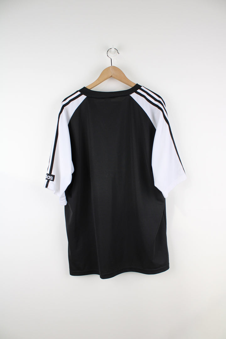 Adidas Training T-Shirt in a black and white colourway, V-neck, 3 stripes going down the sleeves, and big embroidered logo on the front.