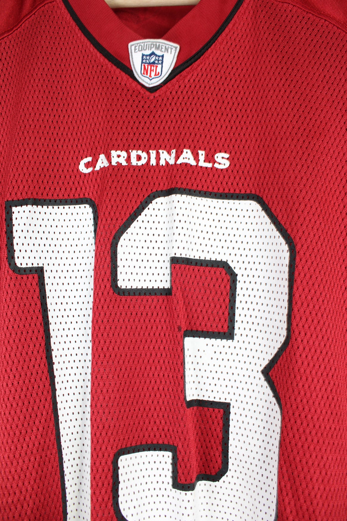 All red Arizona Cardinals NFL jersey, by Reebok. with printed name on the back 