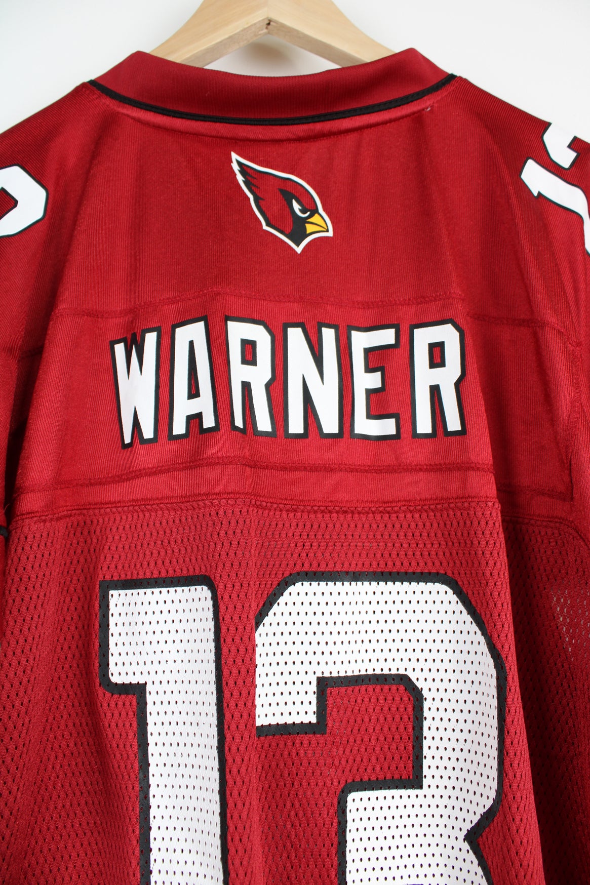 All red Arizona Cardinals NFL jersey, by Reebok. with printed name on the back 