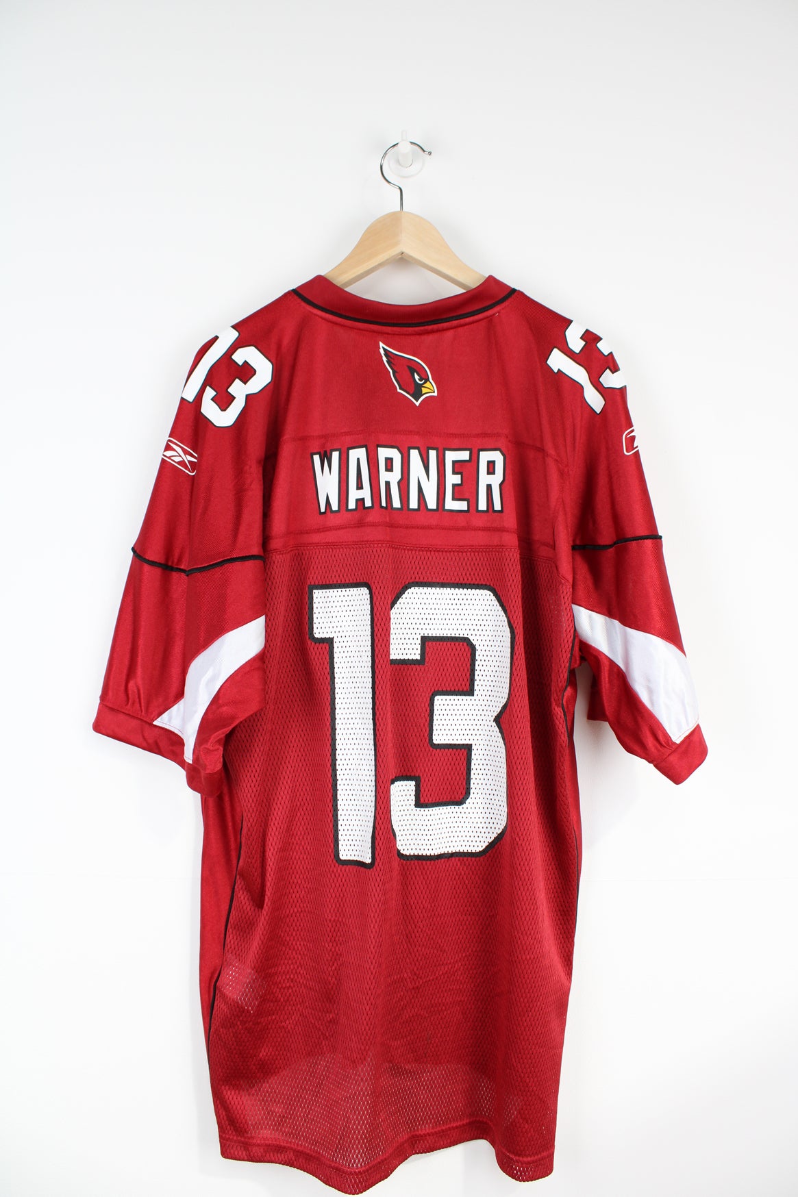 All red Arizona Cardinals NFL jersey, by Reebok. with printed name on the back 