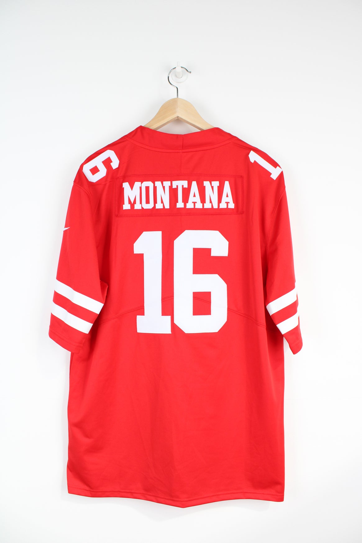 All red San Francisco 49ERS NFL jersey, by Nike. with embroidered name on the back Joe Montana 