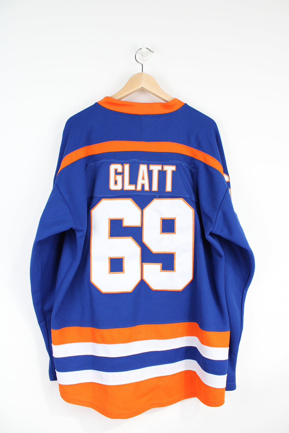 Blue and orange #69 Doug Glatt Halifax Highlanders NHL jersey, with embroidered lettering and badges.