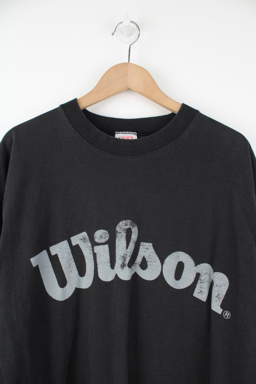 Faded black oversized 100% cotton t-shirt by Wilson, features spell-out graphic across the chest