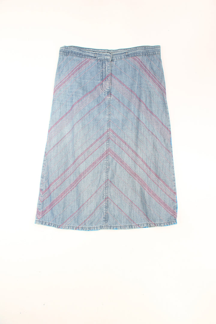 Y2K blue denim skirt by Next with pink contrast stitch chevron pattern throughout. Could be worn mid or low rise depending on measurements.  good condition Size in Label: Womens 10