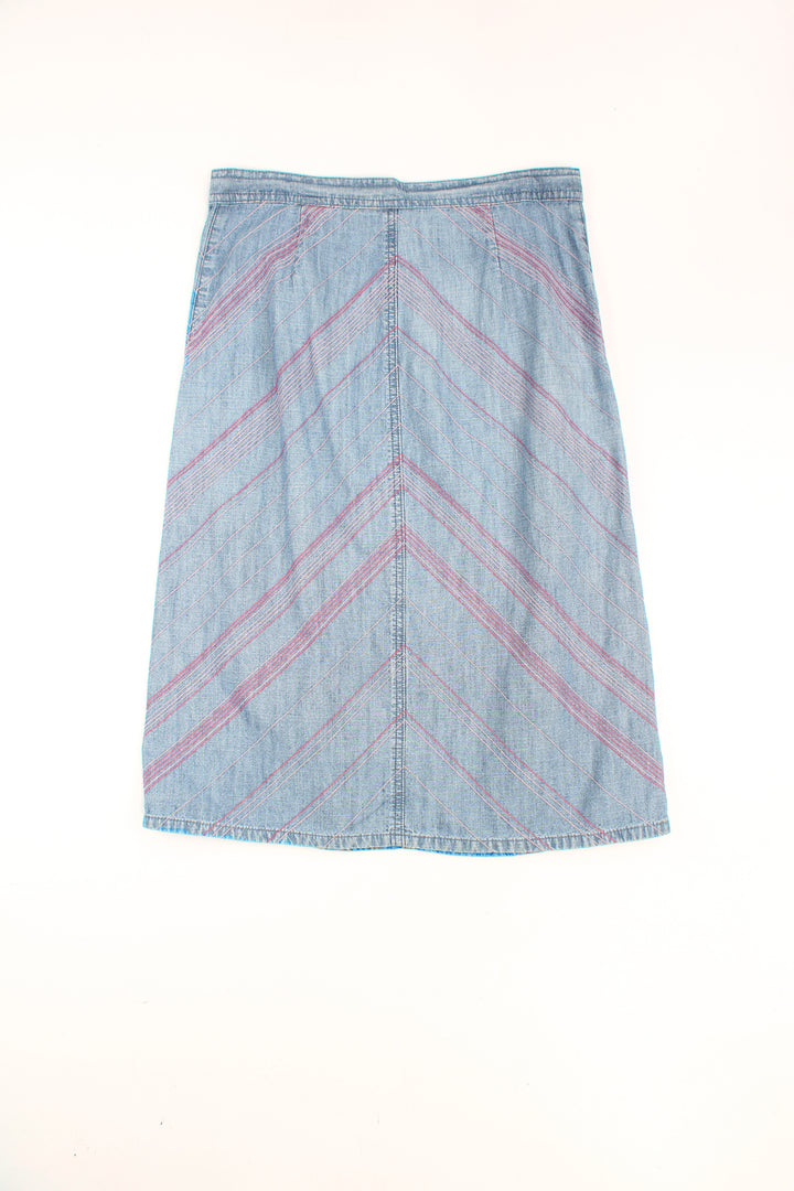 Y2K blue denim skirt by Next with pink contrast stitch chevron pattern throughout. Could be worn mid or low rise depending on measurements.  good condition Size in Label: Womens 10