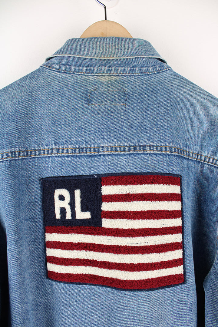 90's Polo Jeans by Ralph Lauren, cropped denim trucker jacket. Features embroidered flag on the back and double pockets