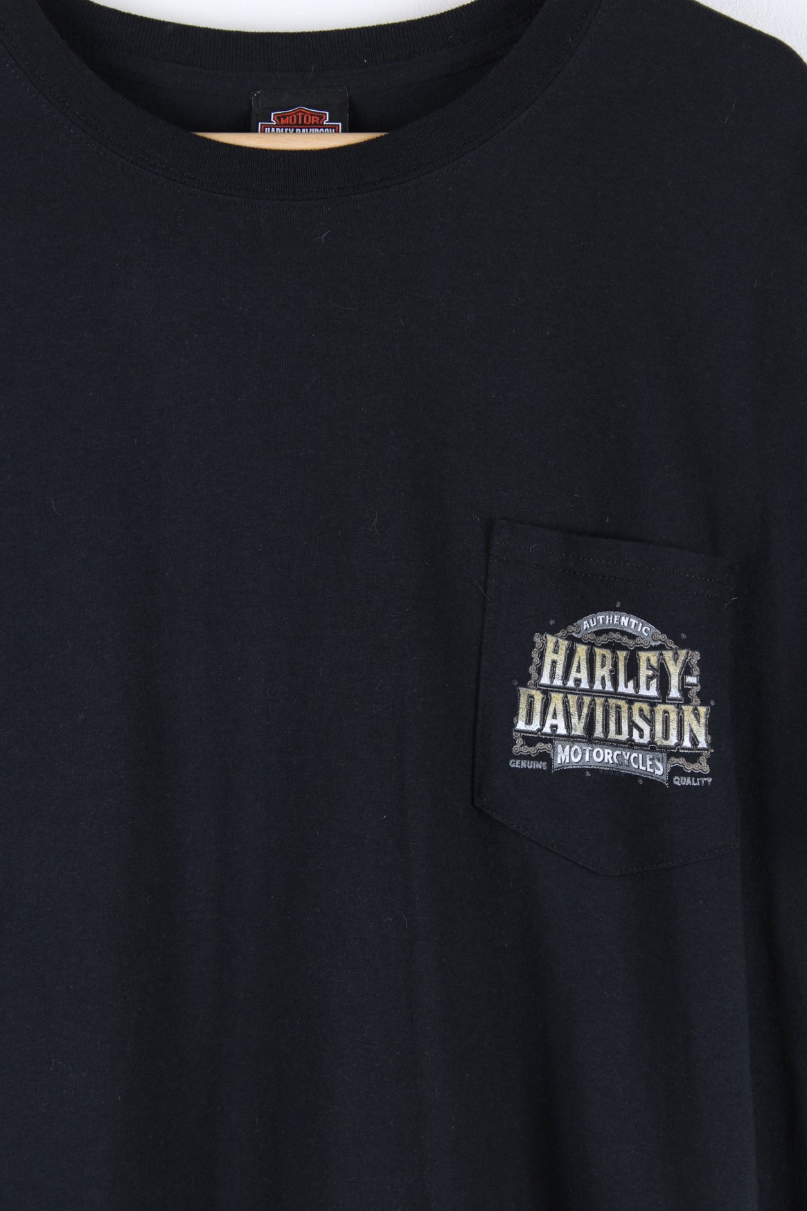 Vintage Harley Davidson Motorcycles Denver, Colorado T-shirt in black, chest pocket on the front with printed logo on it, and has a big Colorado graphic design printed on the back.