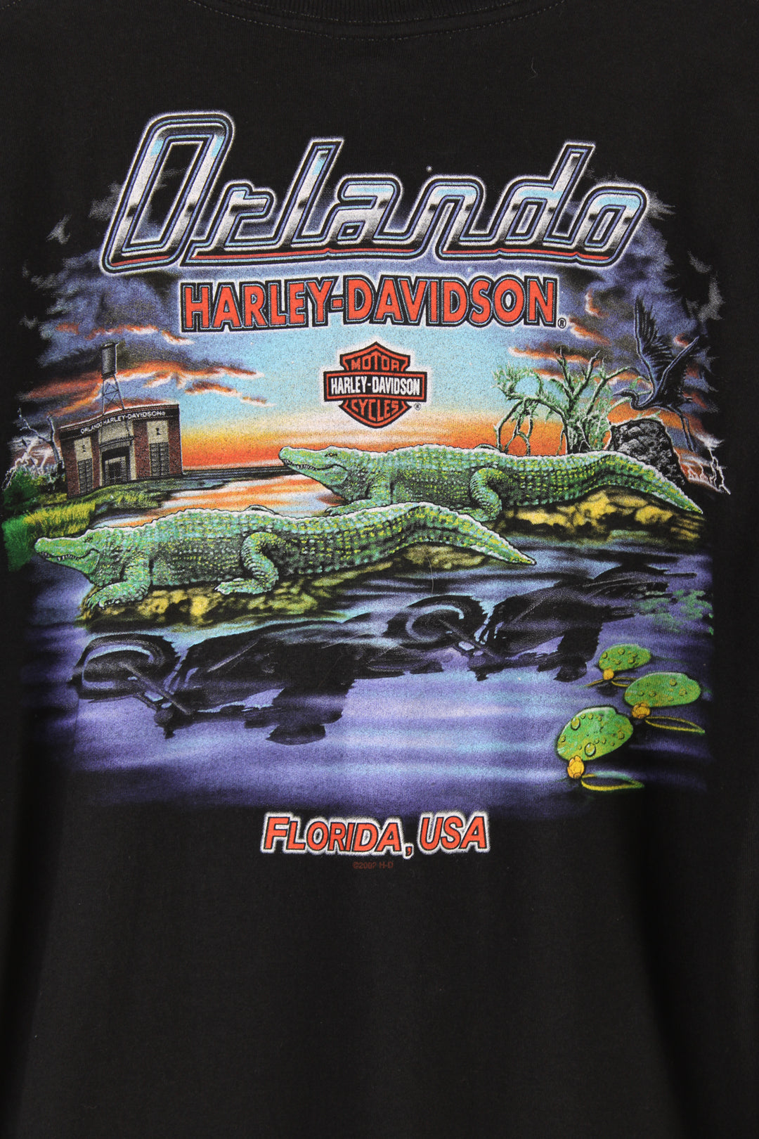 Vintage Harley Davidson Motorcycles Orlando, Florida T-shirt in black, printed logo on the front and Florida crocodiles graphic printed on the back.