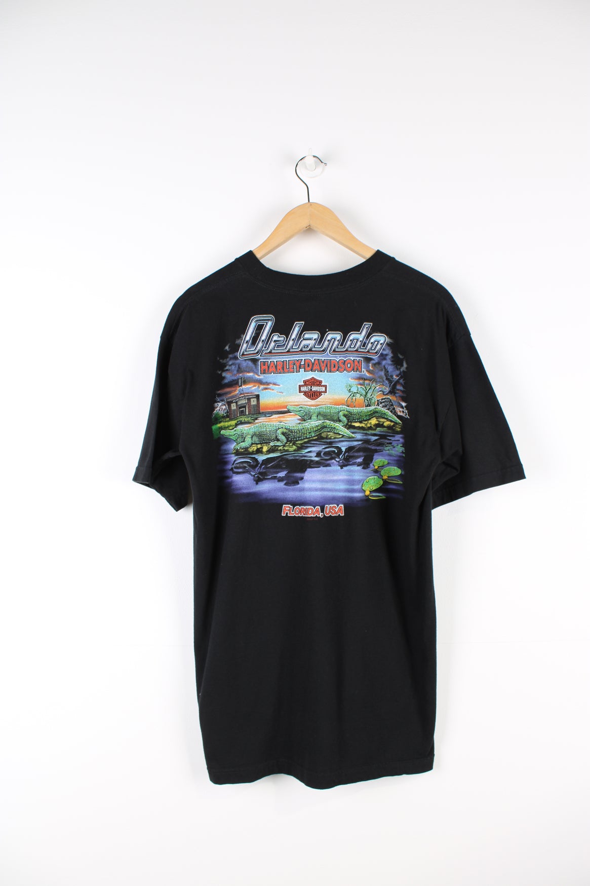 Vintage Harley Davidson Motorcycles Orlando, Florida T-shirt in black, printed logo on the front and Florida crocodiles graphic printed on the back.