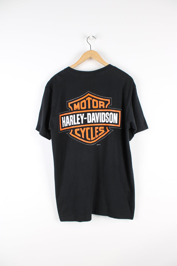 Vintage 1996 Harley Davidson single stitch T-shirt in black, big motorcycle graphic design printed on the front, and big logo on the back. 