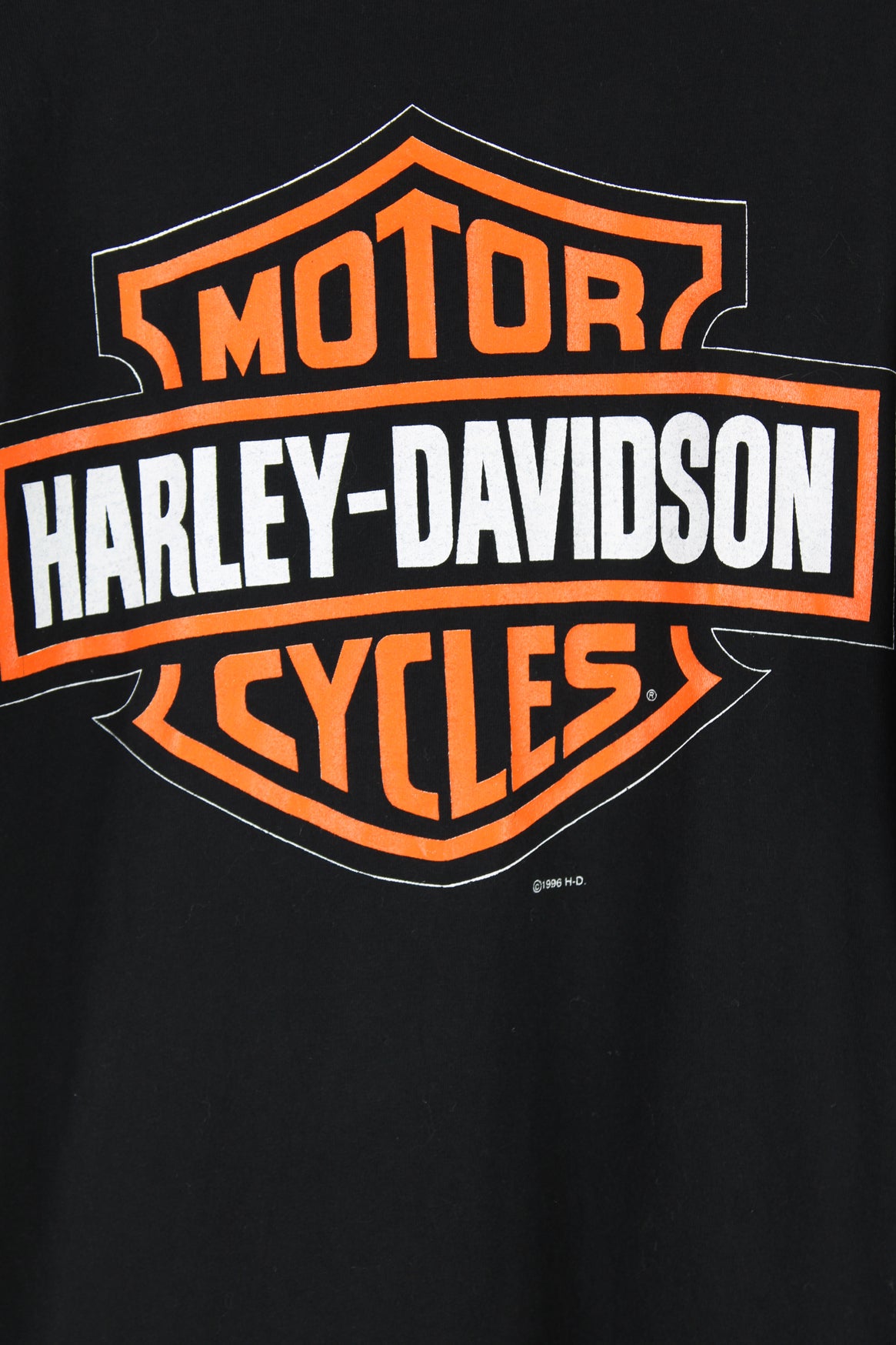 Vintage 1996 Harley Davidson single stitch T-shirt in black, big motorcycle graphic design printed on the front, and big logo on the back. 