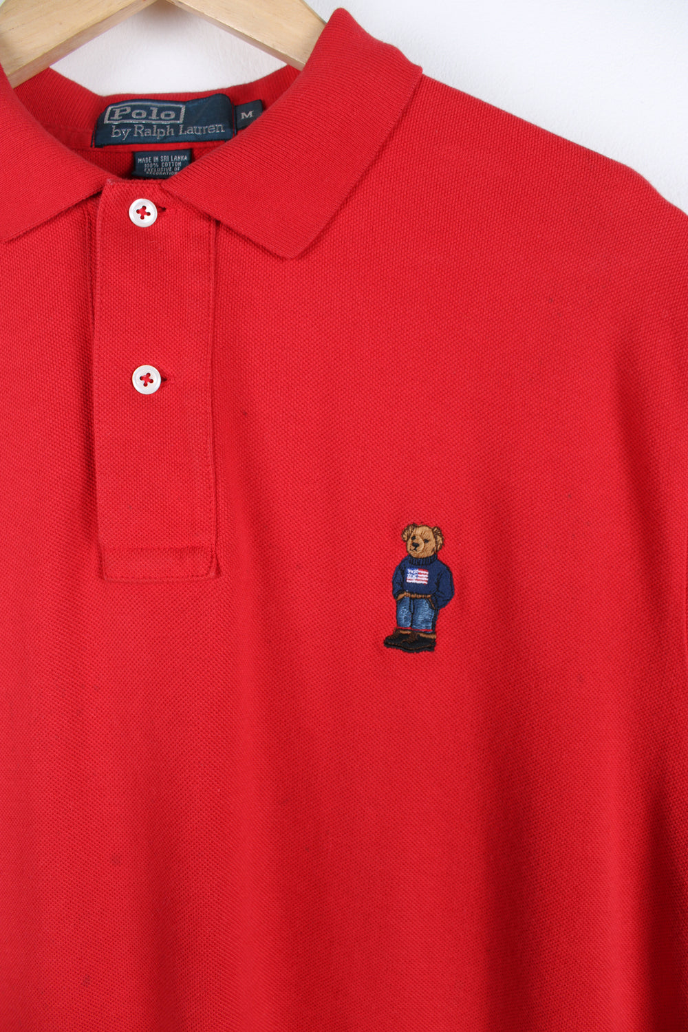 Ralph Lauren all red polo shirt, features embroidered teddy bear on the chest 