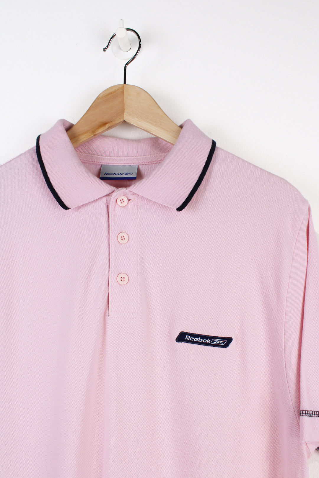 Vintage Reebok pink polo shirt with embroidered logo on the chest good condition Size in Label: Mens M - Measures slightly smaller like a S 