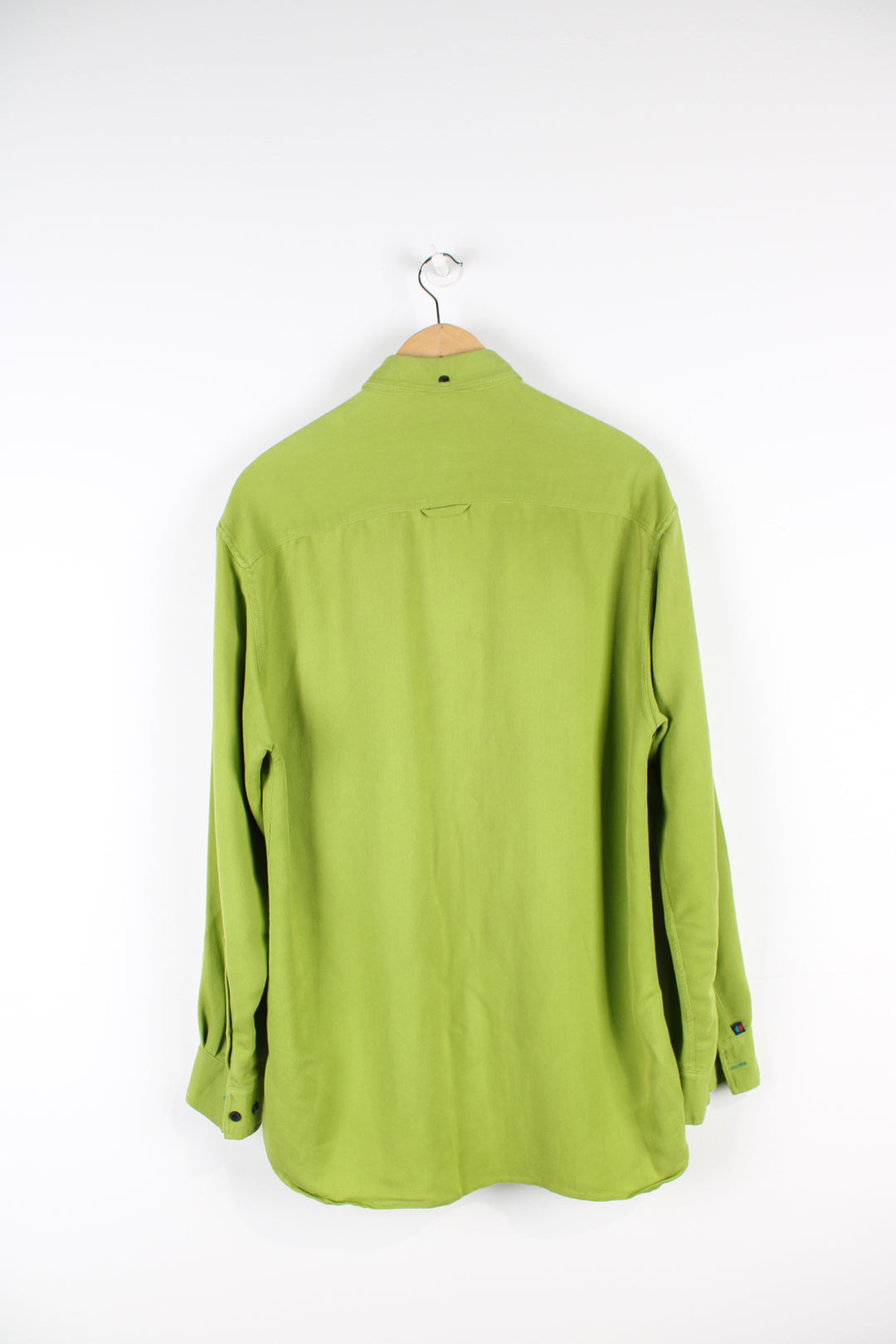 Kickers bright green button up shirt, features embroidered logo on pocket and dagger collar