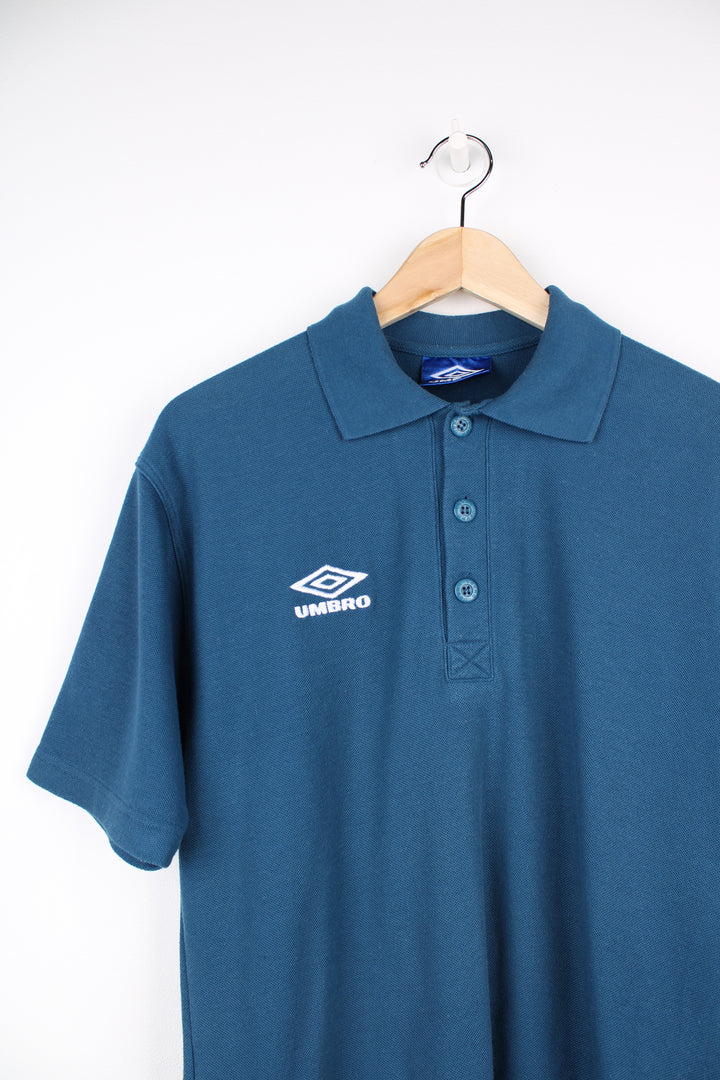 Vintage blue Umbro polo shirt with embroudered logo on the chest. good condition Size in Label: Mens S