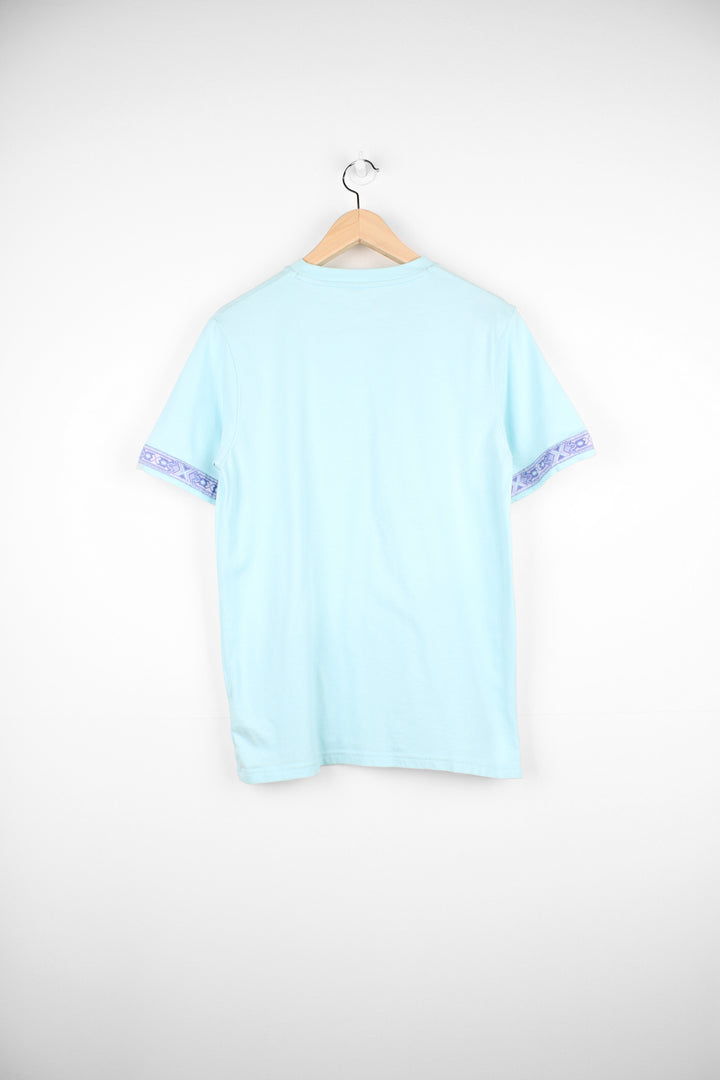 Berghaus light blue t-shirt with printed logo on the chest and lilac pattern ribbon on the arms. good condition Size in label: Womens S